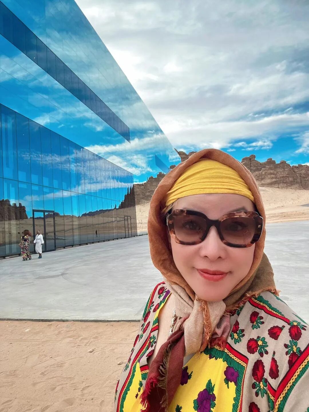 A personal photograph beside Maraya’s mirrored façade.