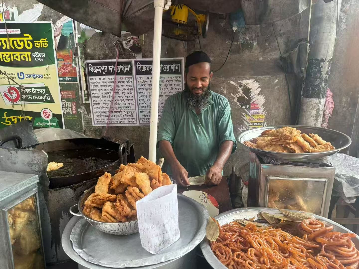 A vendor at a street-food stall.