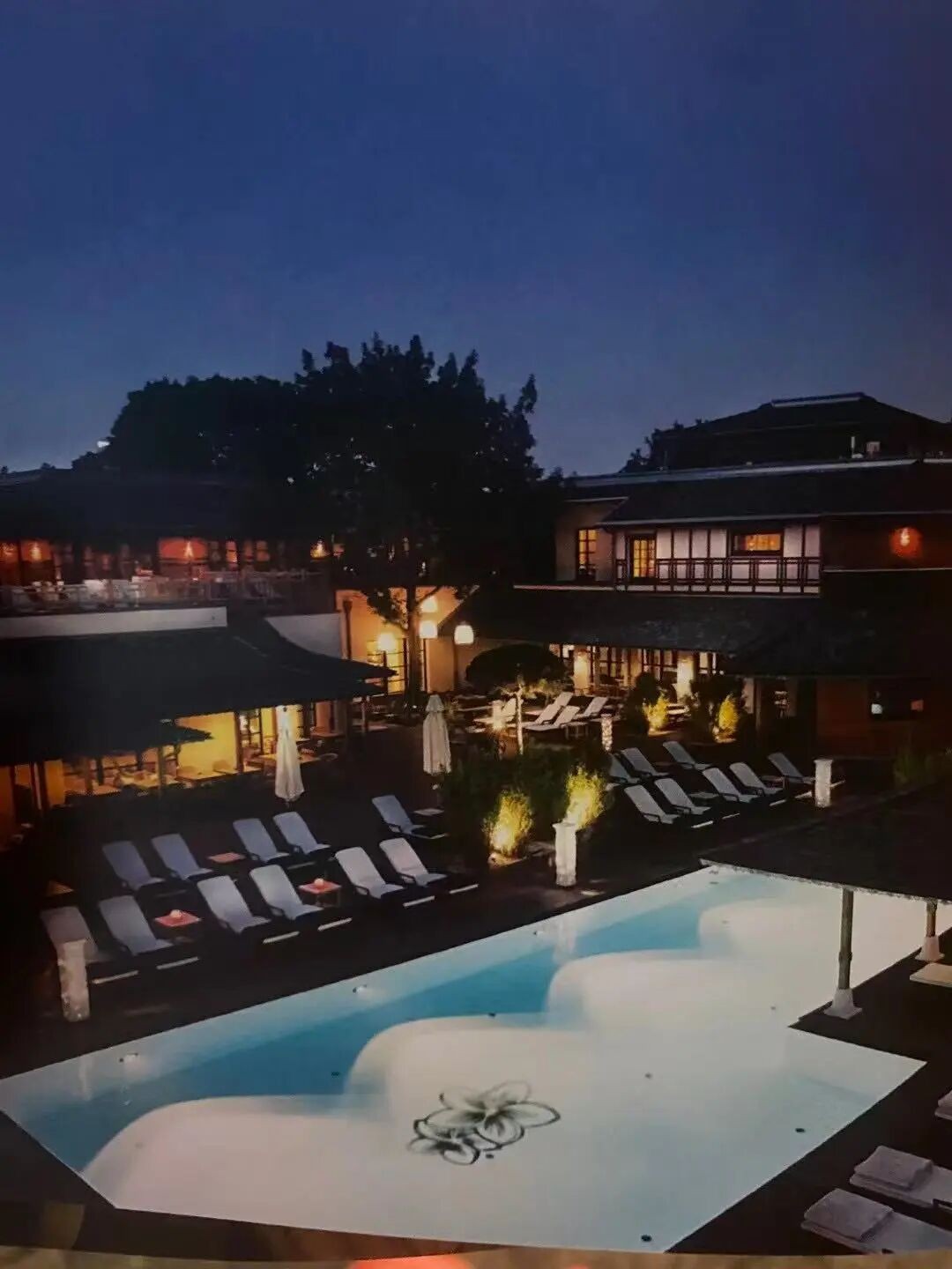 The pool and loungers after dark, photographed on that journey.