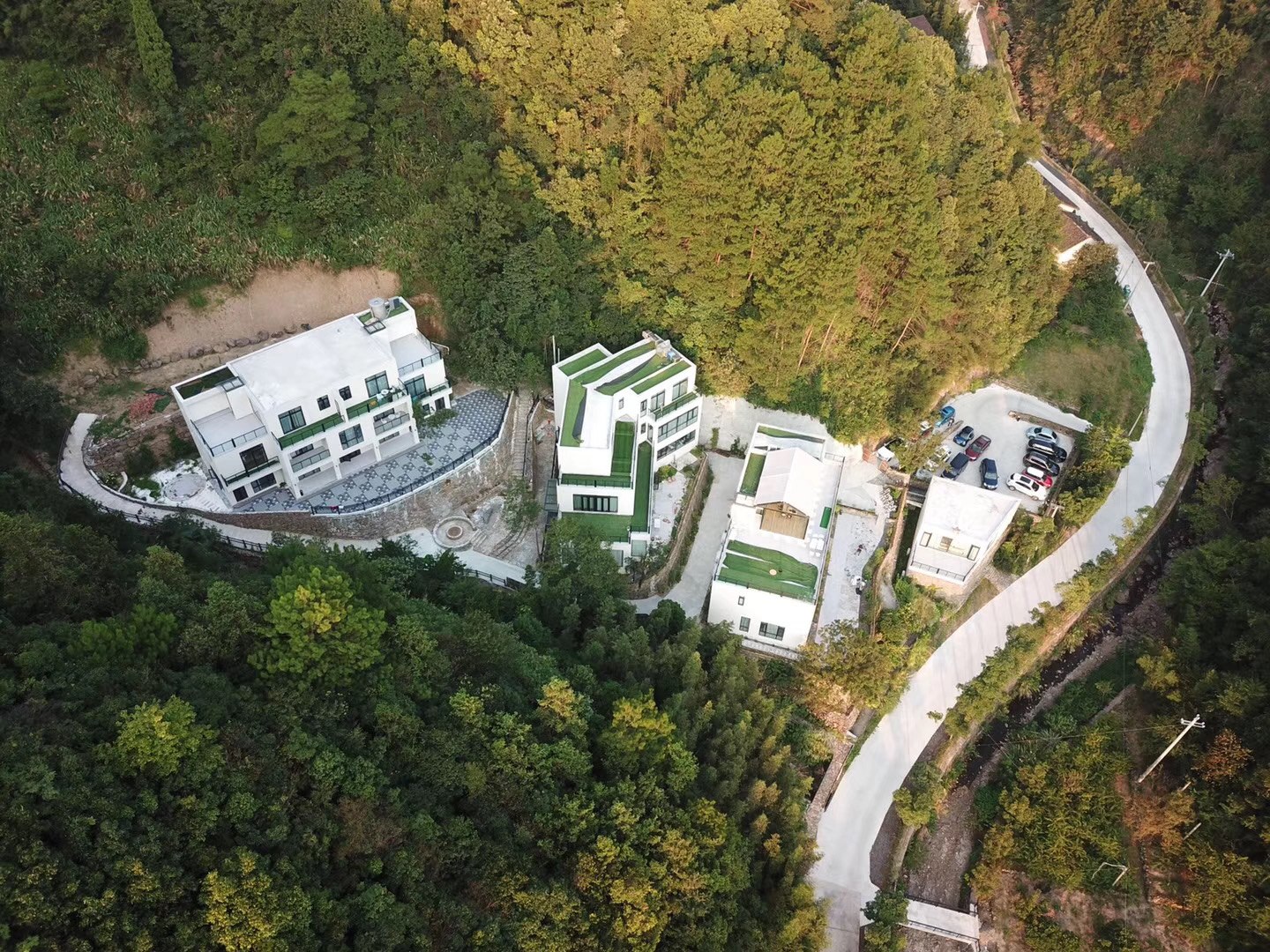 The buildings in their mountain setting.