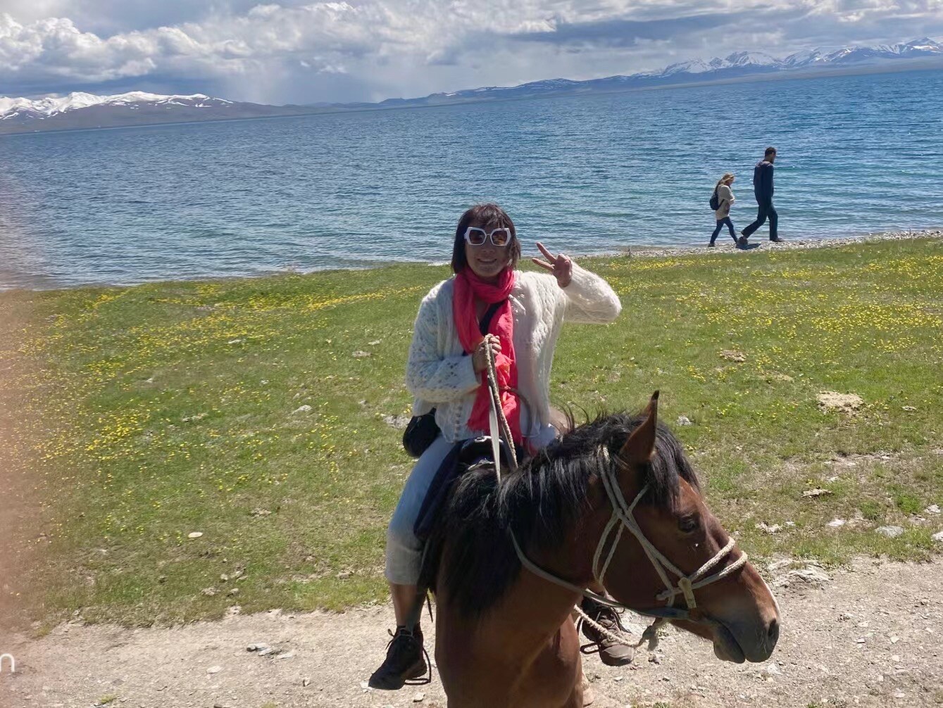 A horse-riding photograph from my saved Kyrgyzstan travel package. The exact lake is not assigned here.