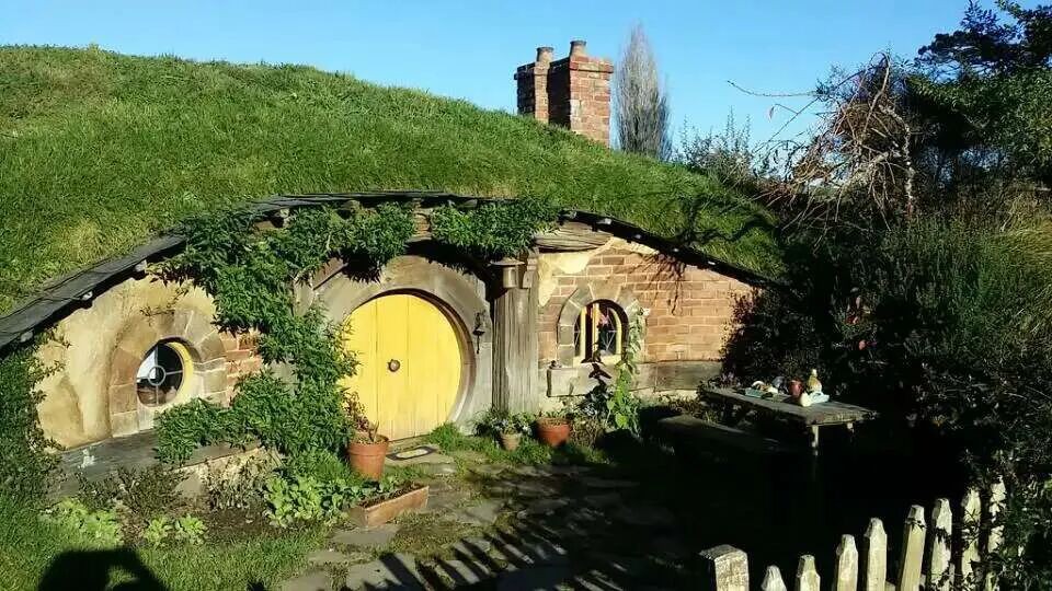 A hobbit house set into the hillside.