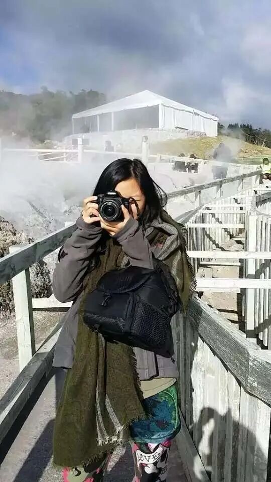 A photograph beside the geothermal steam.